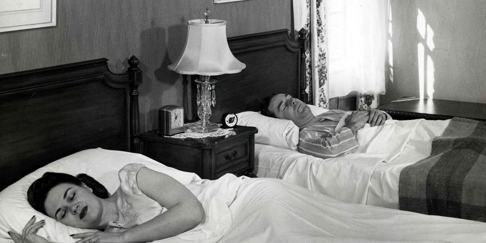couple sleeping apart