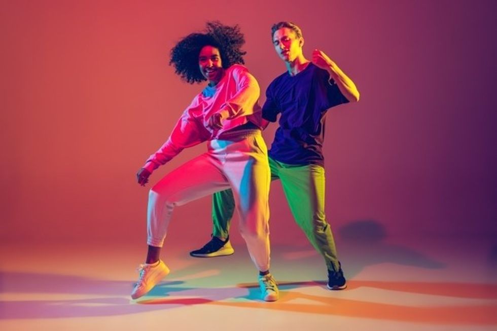 dance time stylish men woman dancing hip hop bright clothes green background dance hall neon light 155003 16406