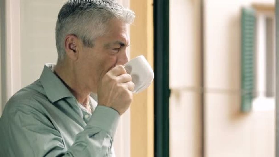 depositphotos 100189254 stock video pensive man drinking coffee at