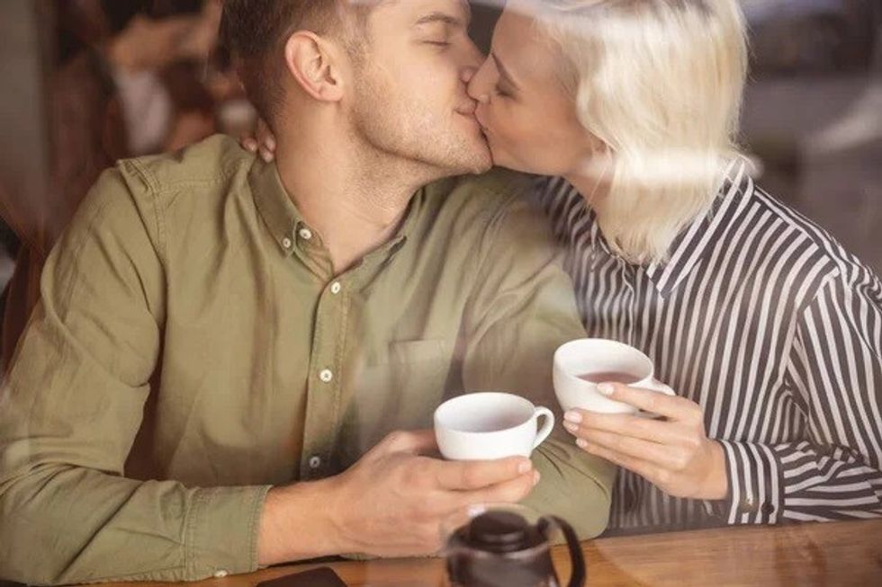 depositphotos 321064750 stock photo happy handsome man kissing his