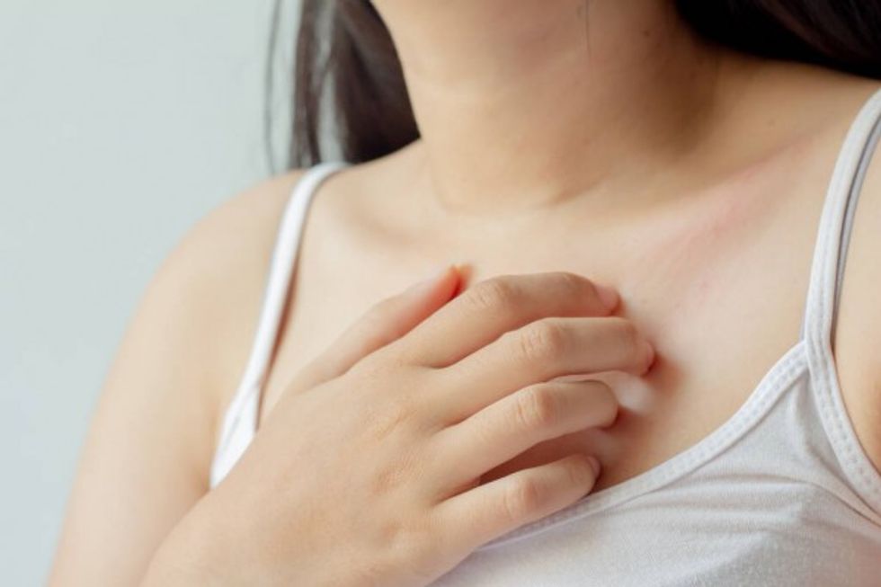 depositphotos 403693008 stock photo young woman scratching itch her