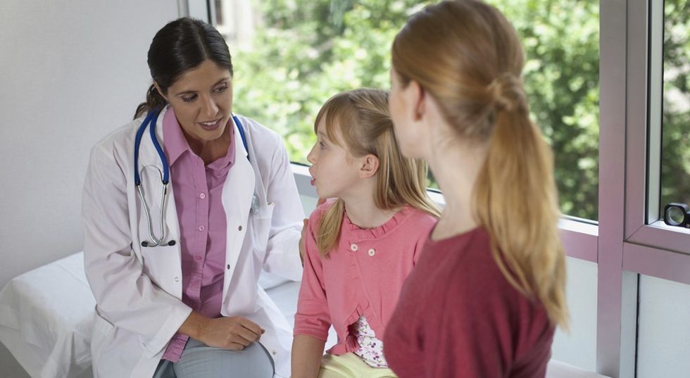 doctor child parent talking cropped 1