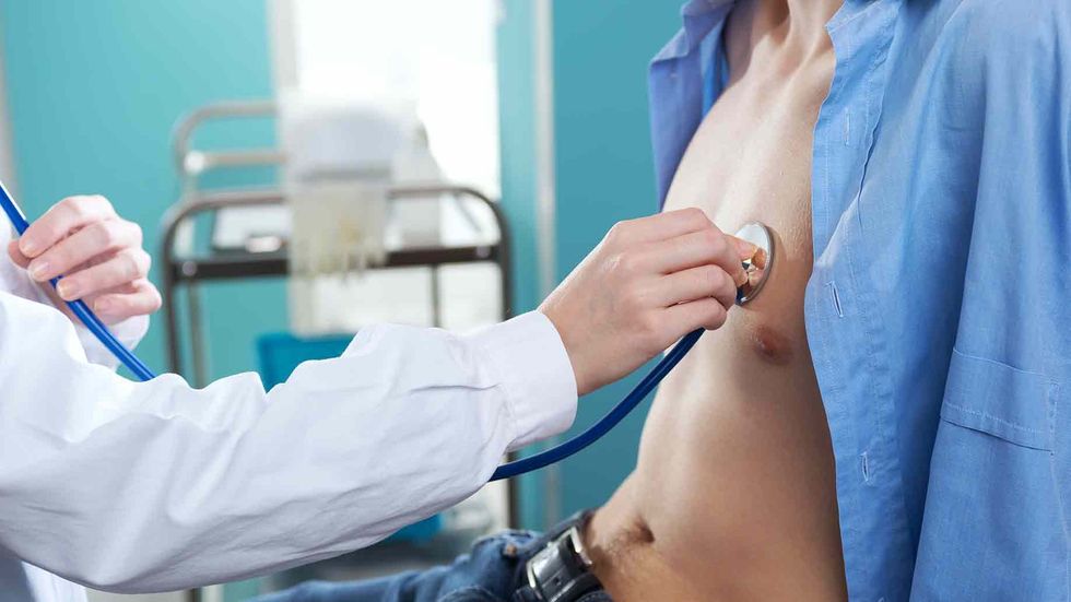 doctor listening heart patient