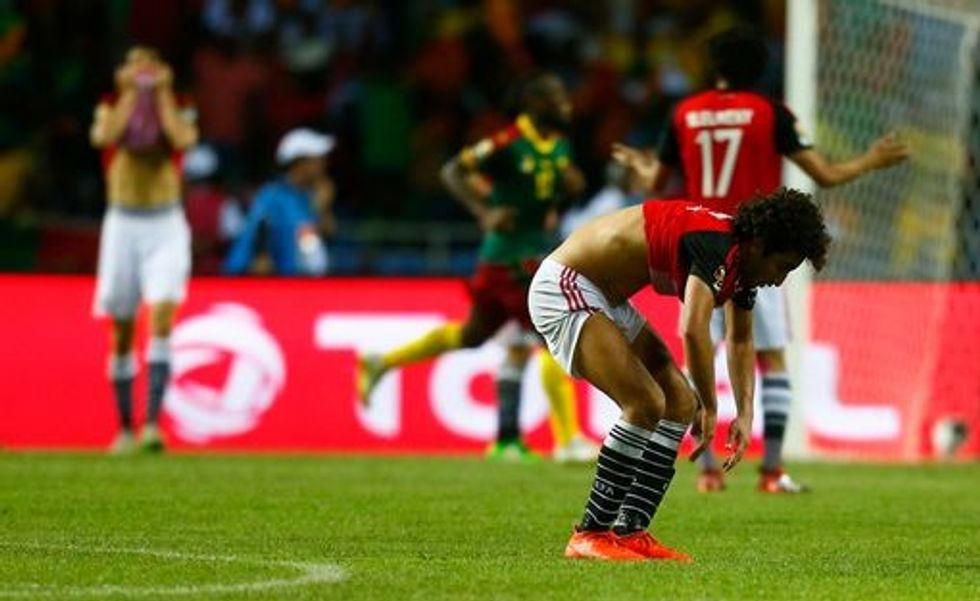 Egypts Amr Warda looks dejected after Cameroons Vincent Aboubakar scores their second goal