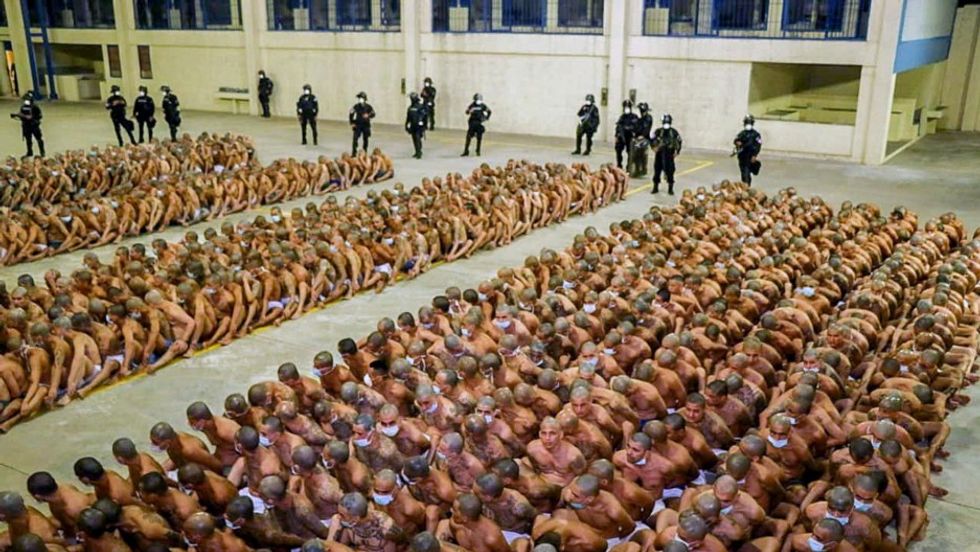 El Salvador lines up semi-naked gang members for grim prison photos