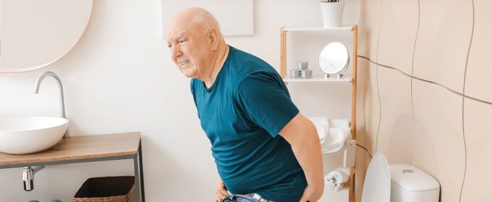Elderly Man with Hemorrhoids Visiting Restroom edited