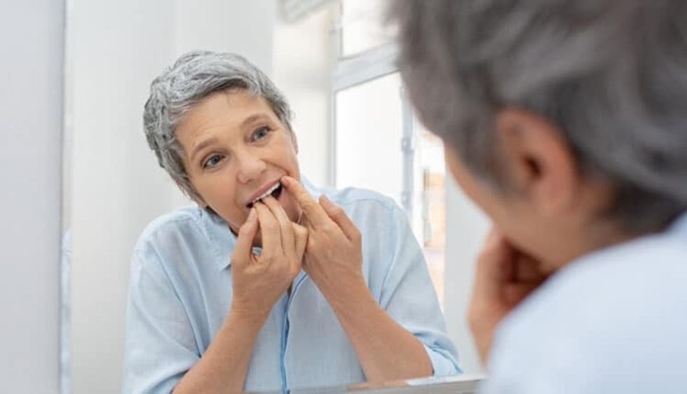 elderly woman flossing 1