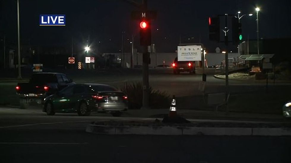 Elon Musk appears to have reopened a Tesla plant in Fremont, California, in defiance of local coronavirus lockdown restrictions. Employees were seen reporting to the Tesla facility in Fremont before sunrise on Monday in footage from local media outlet KPIX (pictured)