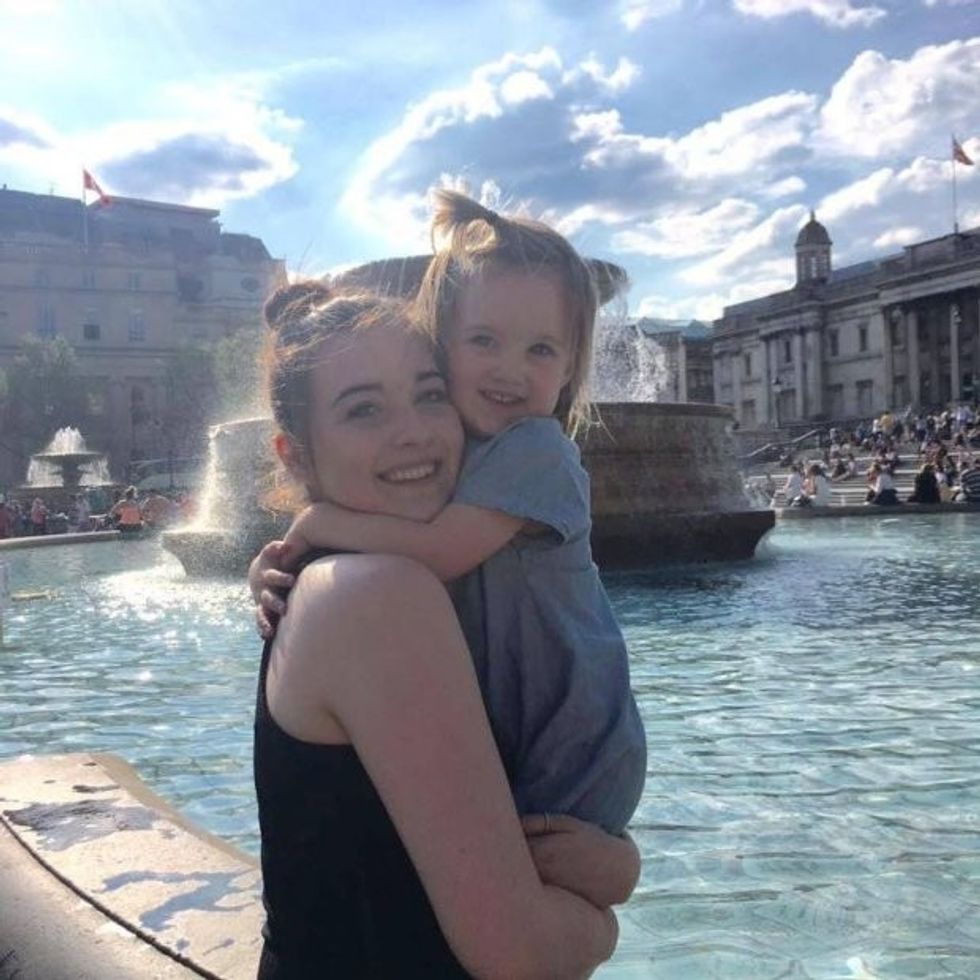 Emily Barrett, 21 with daughter Evie Barrett, 3 from Deeping St James, Lincs. See Masons copy MNBOOT: A three-year-old girl's foot was just seconds away from being horrifically mangled when he boot got caught in an escalator. Little Evie Barrett was out Christmas shopping with mum Emily, 21, when she got her right boot trapped at the bottom of the escalator. As it reached the bottom the steps closed in on each other trapping the child's foot and dragging her into the mechanism.