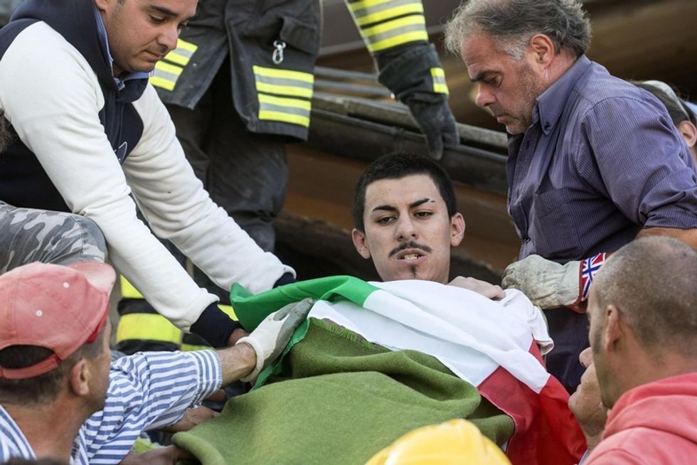 epa05508415 An injured man is rescued from the rubble by emergency teams in Amatrice, central Italy, following a 6.2 magnitude earthquake, according to the United States Geological Survey (USGS), that struck at around 3:30 am local time (1:30 am GMT). The quake was felt across a broad section of central Italy, in Umbria, Lazio and Marche Regions, including the capital Rome where people in homes in the historic center felt a long swaying followed by aftershocks. According to reports at least 37 people died in the quake. EPA/MASSIMO PERCOSSI