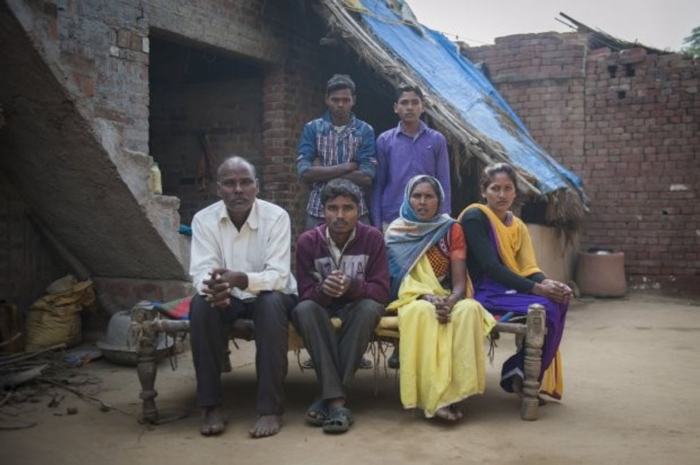 *** EXCLUSIVE - VIDEO AVAILABLE *** FARRUKHABAD, INDIA - DECEMBER 09: Arun Kumar Rajput sits with his father Sri Ram Singh, 55 years (left), mother Kokla Devi , 50 years (right), his sister Aarti (extreme right) and his two brothers Lal Bahadur (back left) and Sudeer Rajput (back right) at his house on December 09, 2015 in Farrukhabad, India. A YOUNG man with FOUR legs appealed to doctors to amputate his two extra limbs. Arun Kumar, 22, was born with two extra legs growing from his lower back - one underdeveloped and the other permanently bent at the knee. After living for 15 years without any kind of treatment, Arun, from Uttar Pradesh, India, appealed through social media for medical help to remove his extra legs. A team of specialists at Fortis Hospital in Delhi responded to Arunís plea for help and organised a series of tests to find out how the legs are attached and if he can be treated. **CONDITION OF USAGE: The following plug must be used in print and/or online: Arun's story appears in Body Bizarre, Thursday November 3, 10pm, on TLCî credit: TLC/ Barcroft Productions** PHOTOGRAPH BY Arkaprava Ghosh / Barcroft Images London-T:+44 207 033 1031 E:hello@barcroftmedia.com New York-T:+1 212 796 2458 E:hello@barcroftusa.com New Delhi-T:+91 11 4053 2429 E:hello@barcroftindia.com www.barcroftimages.com