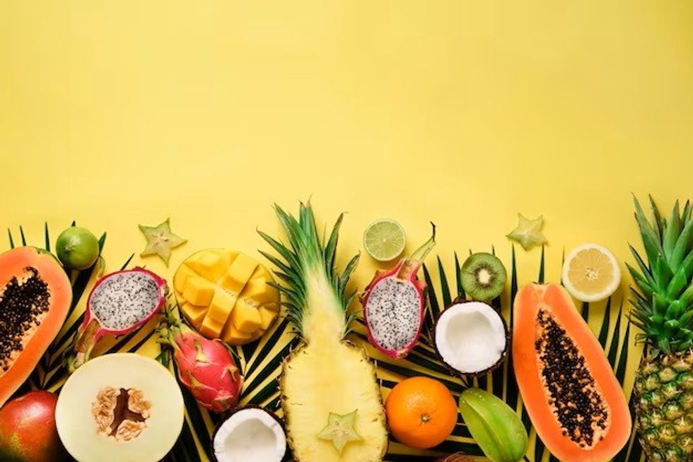 exotic fruits tropical palm leaves