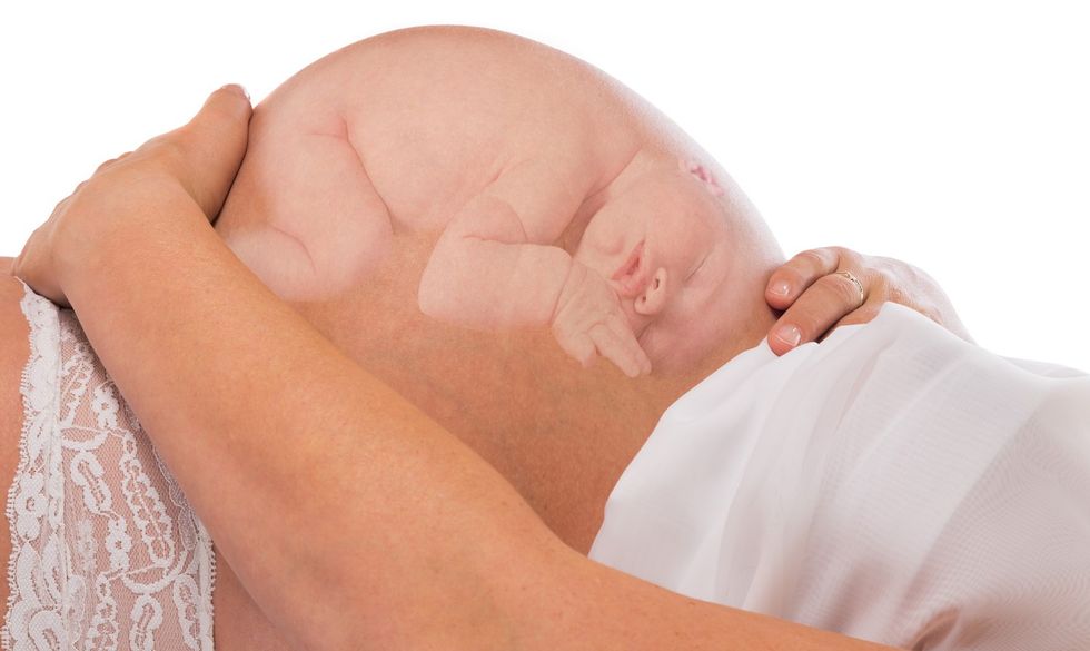 f29aef1c33c3796dc89647ef131a1dfc6dfc3119 image of baby in pregnant belly