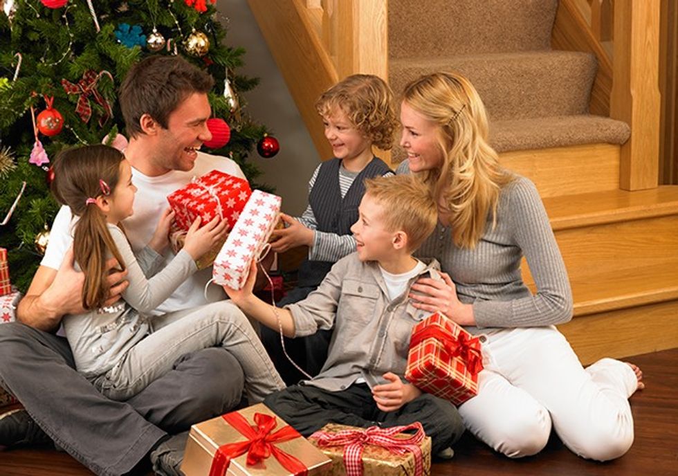 family exchanging presents at christmas