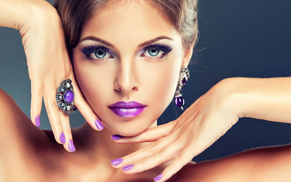 Fashion girl makeup purple lips hands