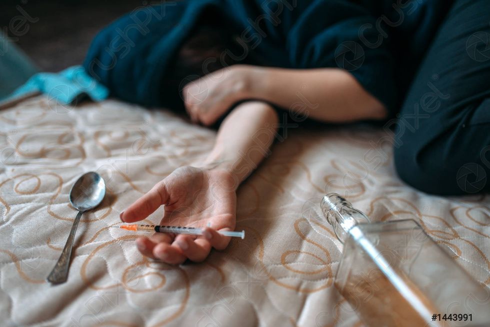 female druggy with syringe hand 1443991