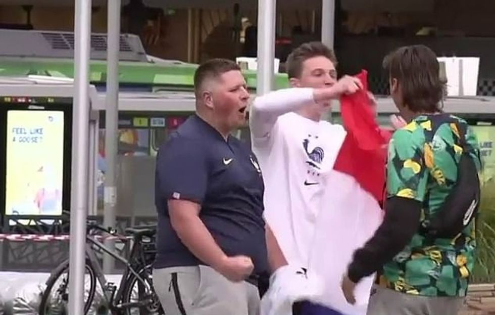Footage emerged of Socceroos supporters snatching flags from French fans while watching the game in Federation Square