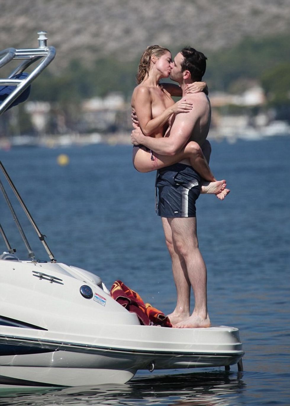 For Paul Ashton.Free to use for Mail online.Recently Married CBeebies star Sarah Jane Honeywell and now husband Ayden Callaghan from Hollyoaks on holiday in Mallorca in 2013.***Boat pics have been seen but Golf course photos have never been put out.***They played on a boat in a cove in Pollensa then we seen at Pollensa Golf Course playing gold before they disappeared into the bushes together.