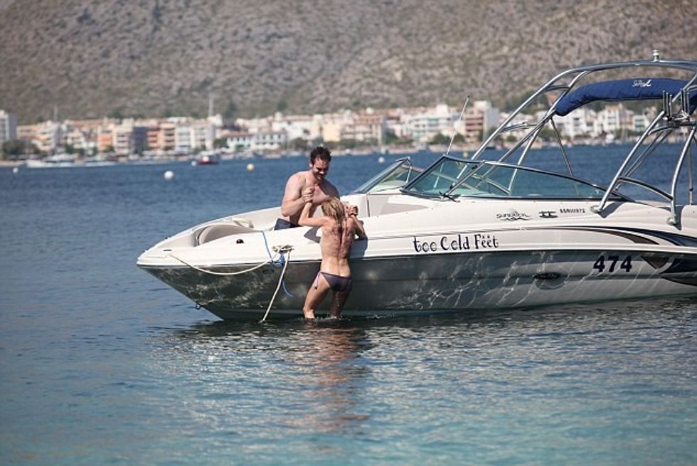 For Paul Ashton.Free to use for Mail online.Recently Married CBeebies star Sarah Jane Honeywell and now husband Ayden Callaghan from Hollyoaks on holiday in Mallorca in 2013.***Boat pics have been seen but Golf course photos have never been put out.***They played on a boat in a cove in Pollensa then we seen at Pollensa Golf Course playing gold before they disappeared into the bushes together.