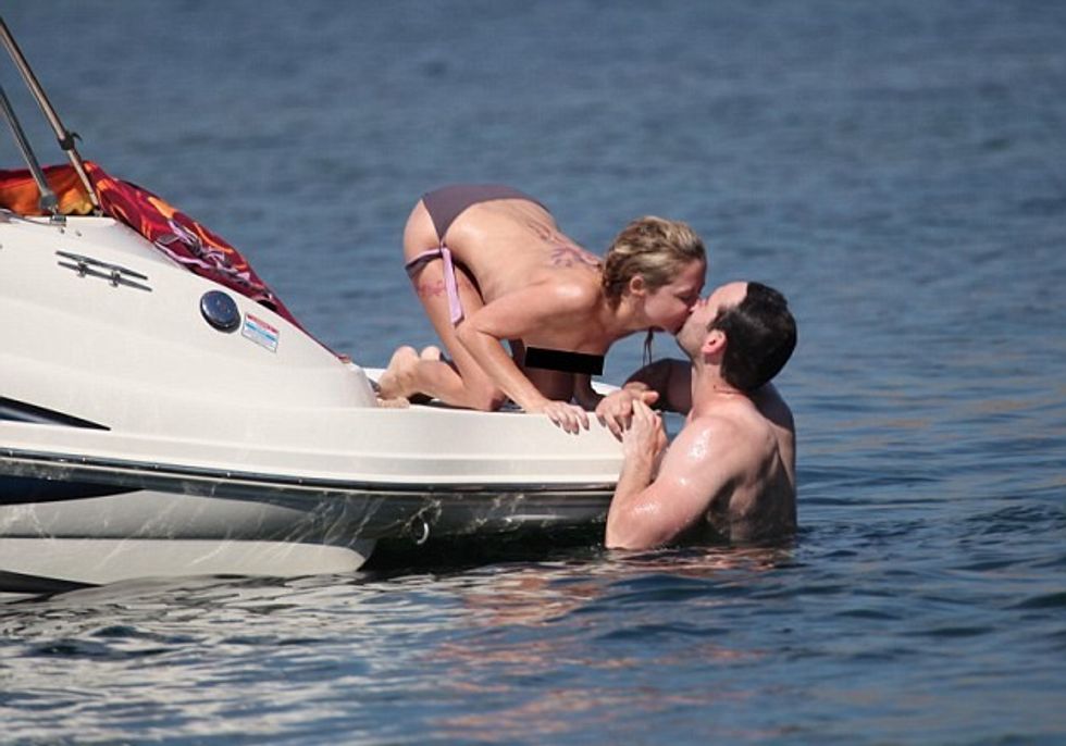 For Paul Ashton.Free to use for Mail online.Recently Married CBeebies star Sarah Jane Honeywell and now husband Ayden Callaghan from Hollyoaks on holiday in Mallorca in 2013.***Boat pics have been seen but Golf course photos have never been put out.***They played on a boat in a cove in Pollensa then we seen at Pollensa Golf Course playing gold before they disappeared into the bushes together.