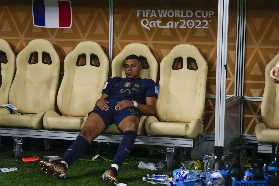 frances kylian mbappe sits on the bench at the end of the world cup final socce