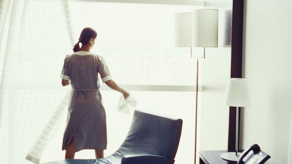 gallery-1435607013-hotel-maids-cleaning-curtains