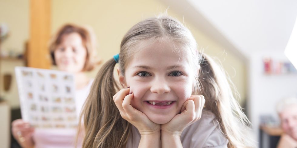 Germany, Munich, Portrait of girl with bunches, smiling