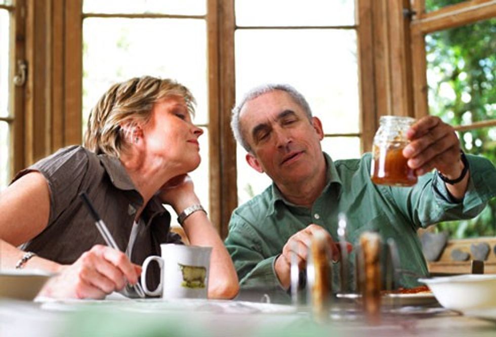 getty rf photo of mature couple discussing honey jar and weight maintenance