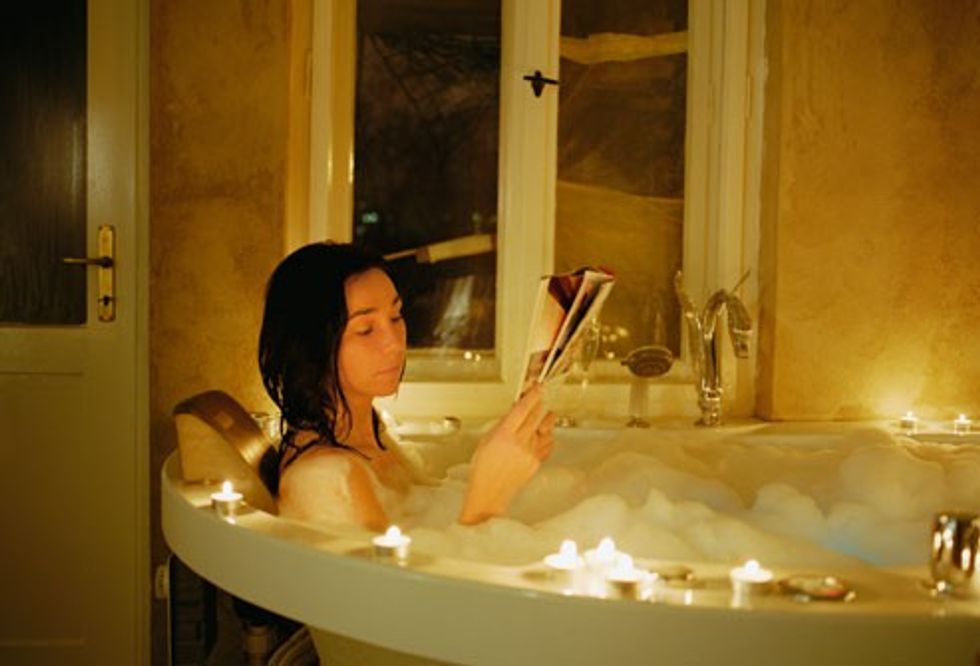 getty rm photo of woman relaxing in bath