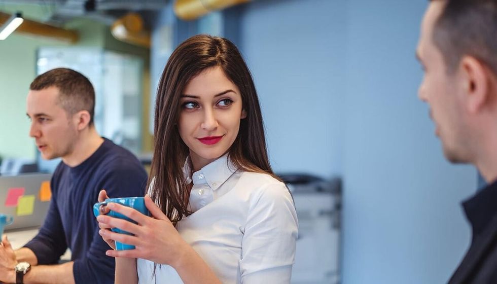 GETTY woman flirting in office 150920 1120