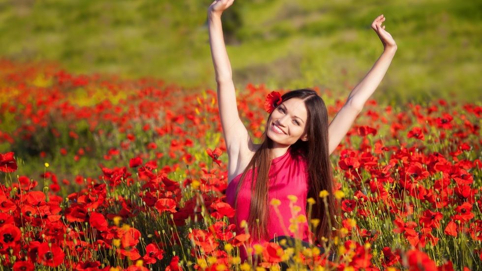 Girls Girl in a red dress on a field of poppies 097133