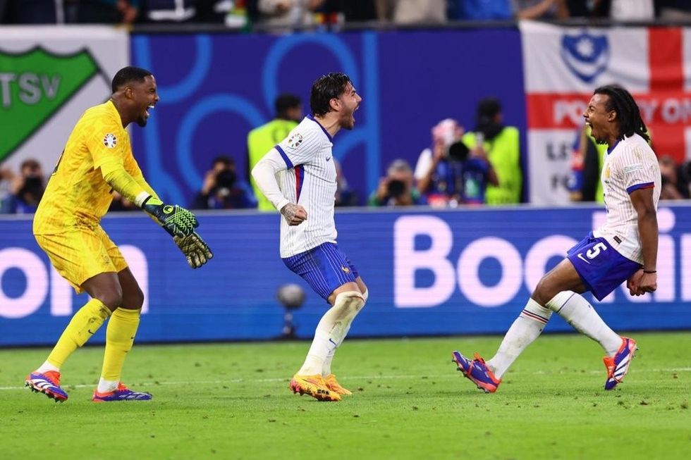 goalkeeper mike maignan theo hernandez and jules kounde of france celebrate after winning the penalty shootout of the uefa euro 2024 quarter finals soccer match between france and portugal efe