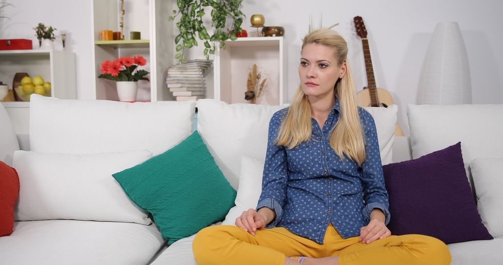 handsome woman sneezing when watch footage 085547769 prevstill