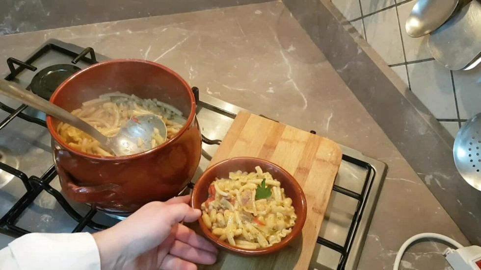 happy couple sitting on kitchen table eating sp