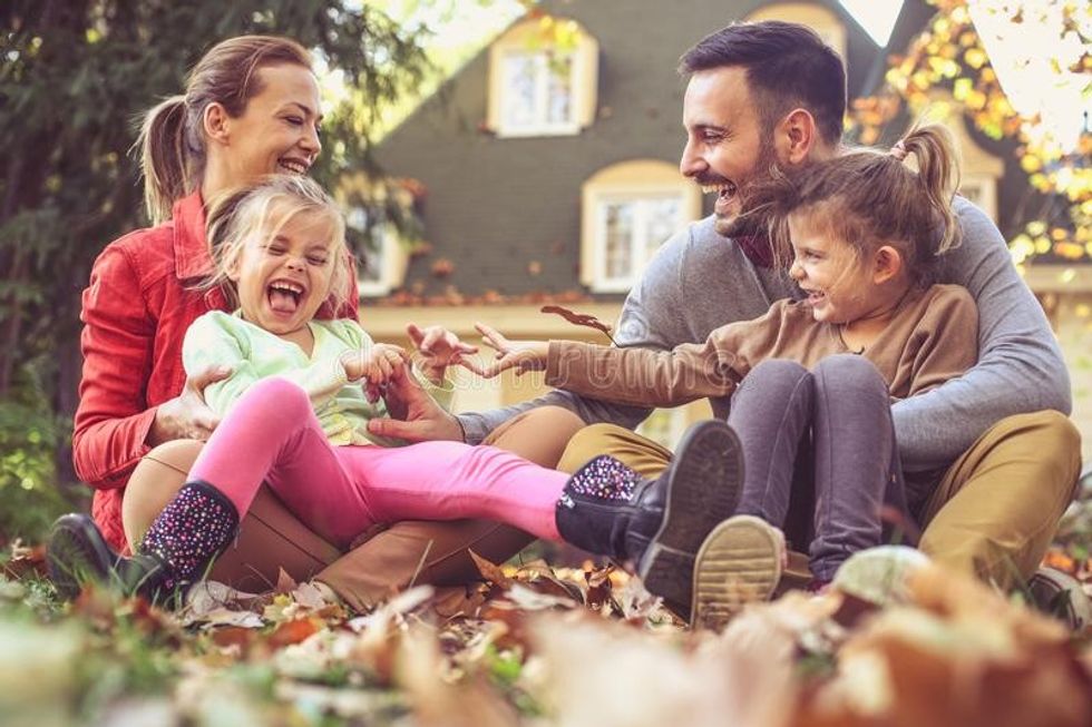 happy parents have play children outside autumn season hap