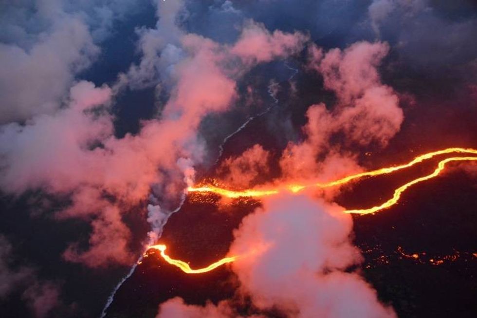 hawaii kilauea volcano lava flows spilling into the ocean