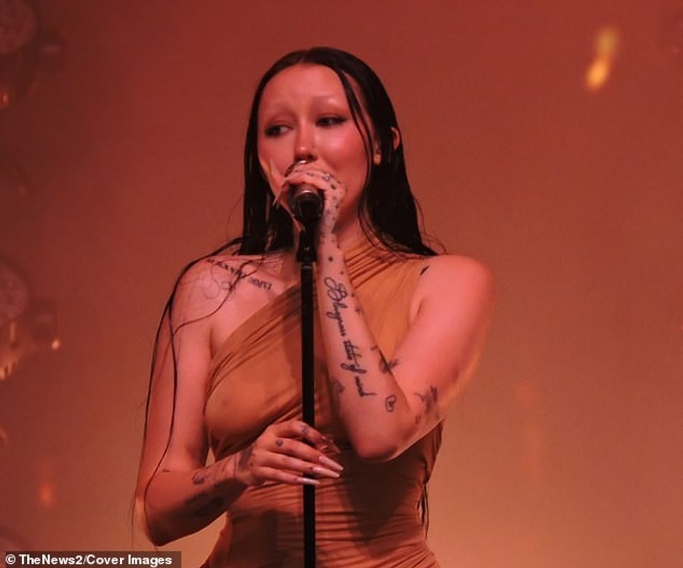 Her X-rated bodycon gown molded to her body displaying her hourglass figure and long legs