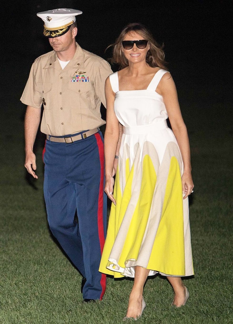 https://www.usmagazine.com/wp content/uploads/melania trump yellow 2580aed8 e07d 41c3 9800