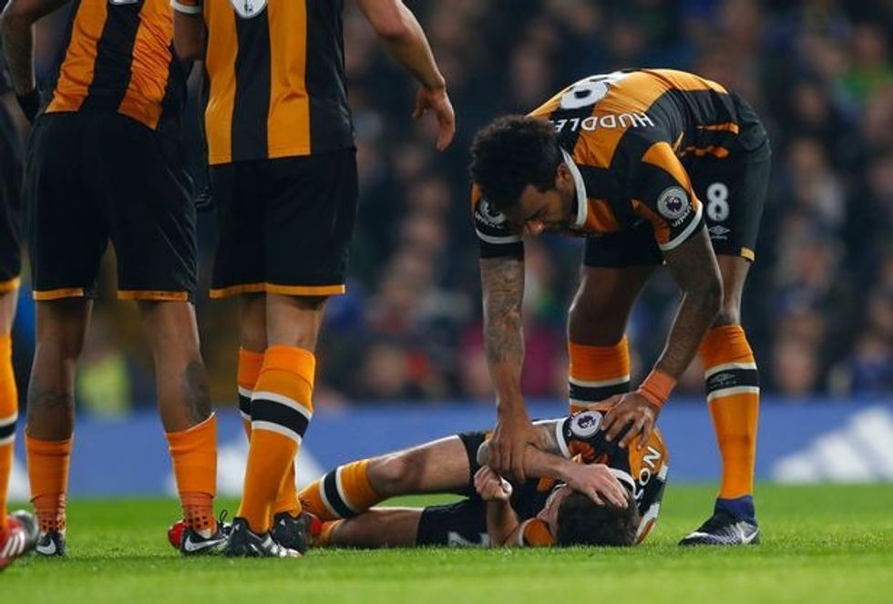Hull Citys Ryan Mason lies injured