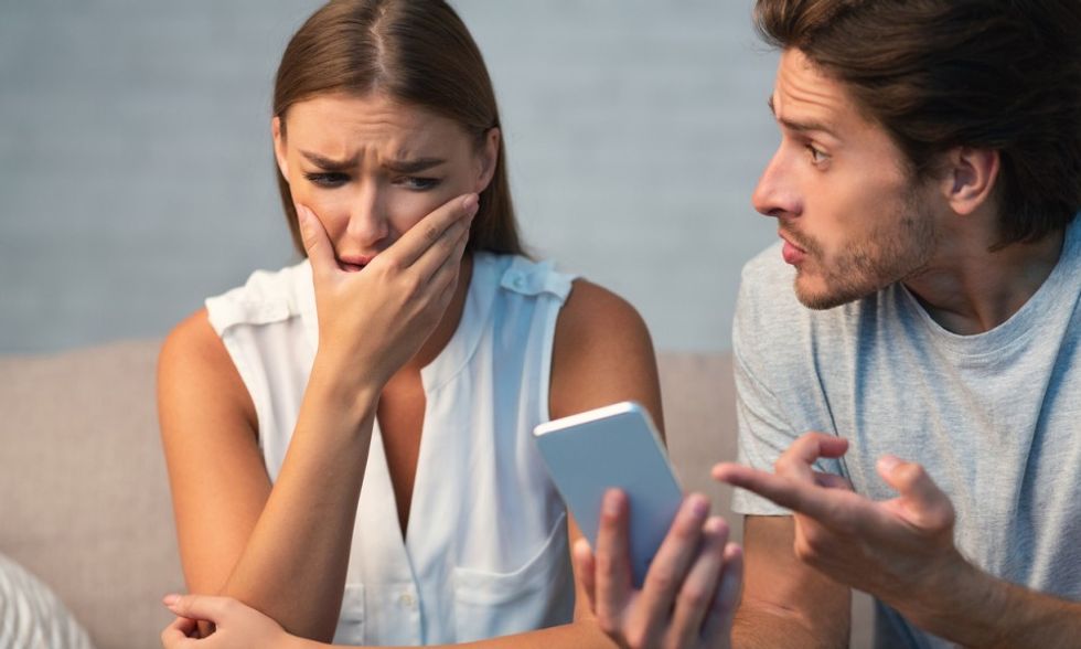 husband showing cheating wife her phon