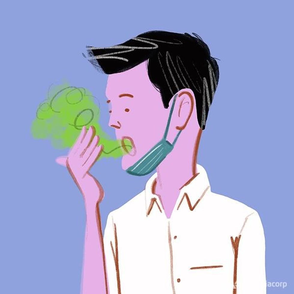 illustration of man with mask pulled down sniffing his breath