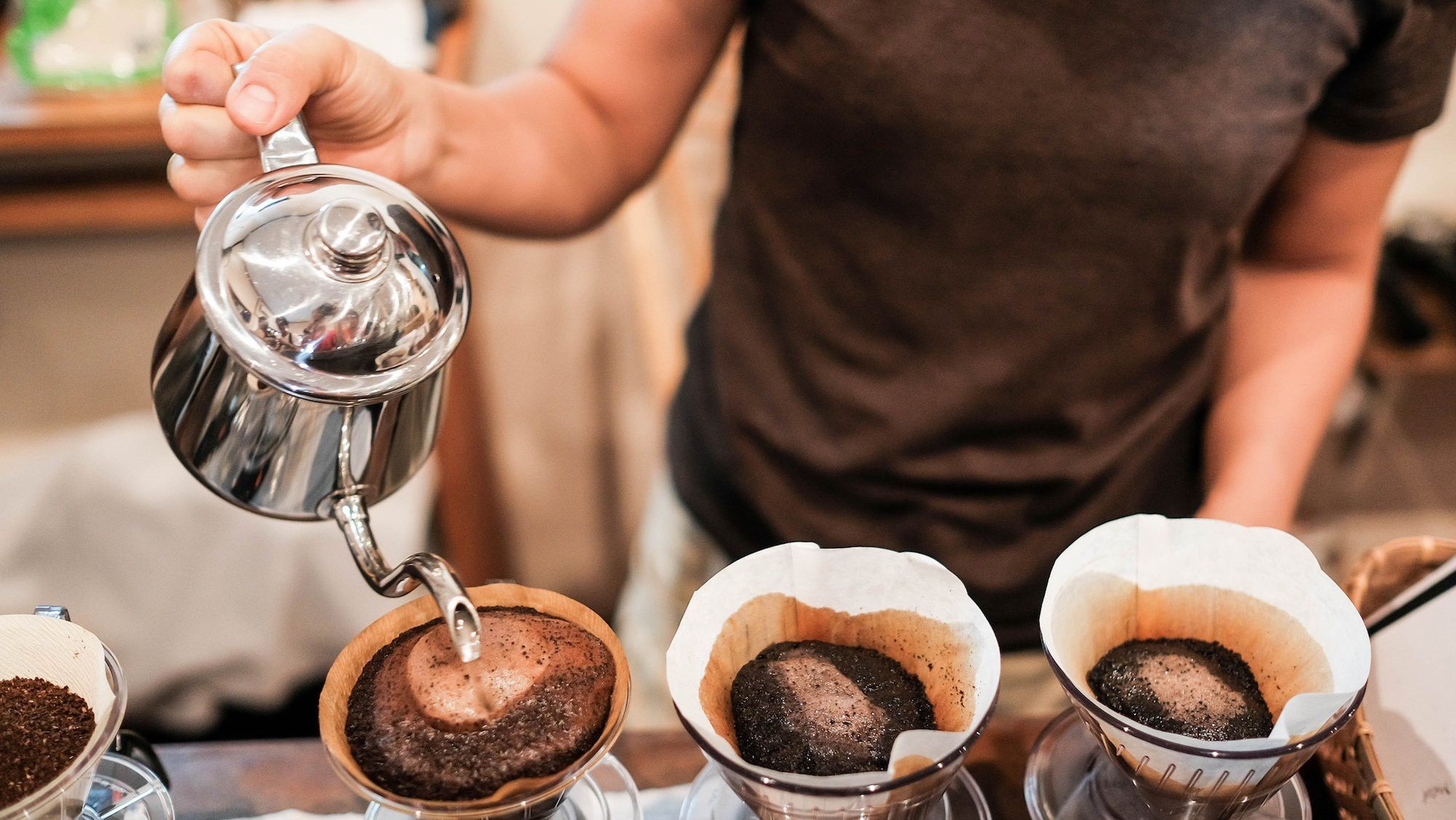 2018/04/brewing-black-coffee-pour-over-cup-barista-shutterstock473186929.jpg