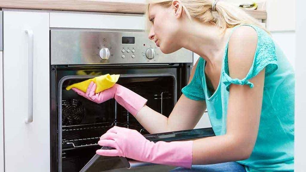 2019/01/woman-cleaning-oven.jpg