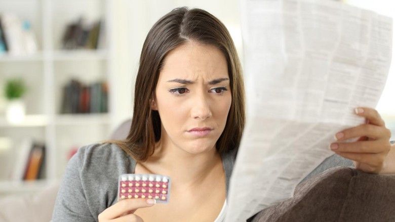 2019/03/woman-reading-leaflet-after-losing-a-birth-control-pill.jpg