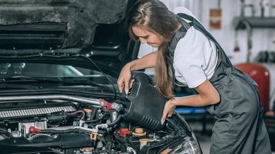 2022/01/beautiful-girl-black-jumpsuit-white-t-shirt-is-smiling-checking-oil-level-black-car-garage_161422-1324.jpg