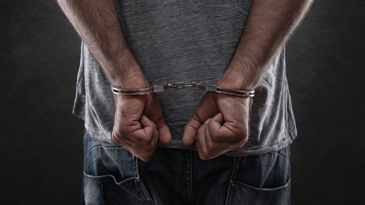 2022/06/Arrested-criminal-with-handcuffs-on.jpg