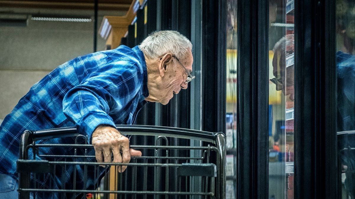 2022/07/0_Elderly-Man-Supermarket-Grocery-Shopper-Looking-Through-Refrigerated-Section-Cooler-Window.jpg