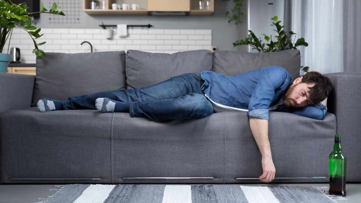 2022/08/0_Drunk-man-sleeping-on-the-couch-in-the-kitchen.jpg
