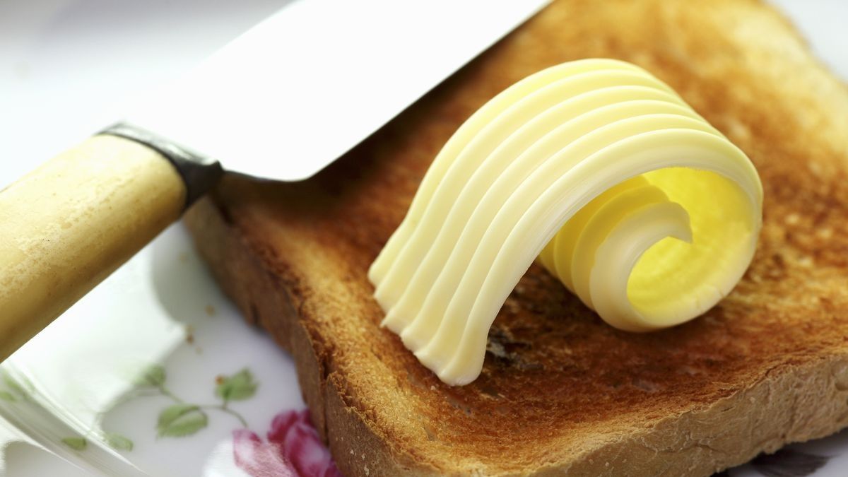 2022/09/0_Slice-of-toast-with-curl-of-butterjpgThe-woman.jpg