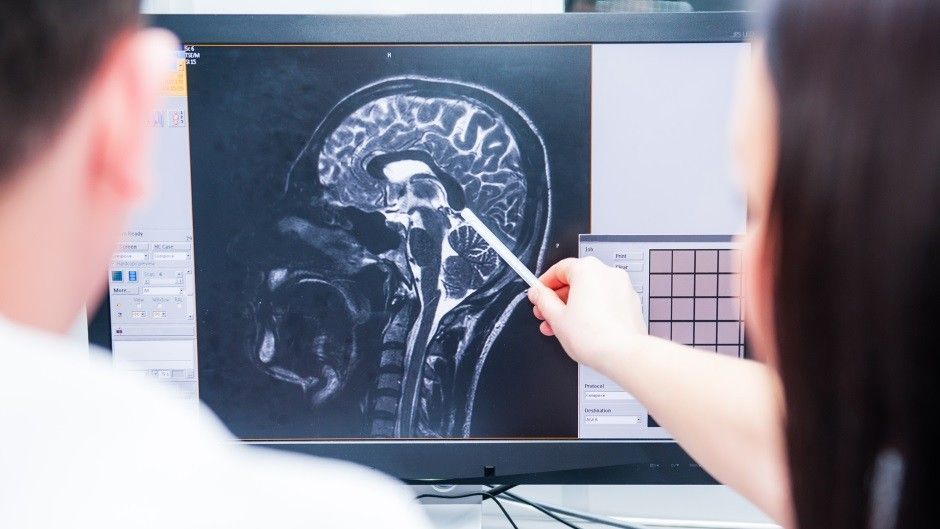 2023/01/horizontal-medicine-brain-checking.-doctors-consider-and-discuss-magnetic-resonance-image-mri-of-the-brain.-tomography-service.-back-view-selective-focus.jpg
